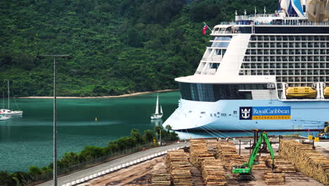 Zoom-out-shot-over-a-lumberyard-with-piles-of-wood-for-exporting-in-Picton-South-Island-in-New-Zealand-at-daytime