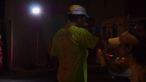 Runner-takes-a-break-during-the-Samui-Run,-running-contest-around-the-island-of-Koh-Samui,-Thailand