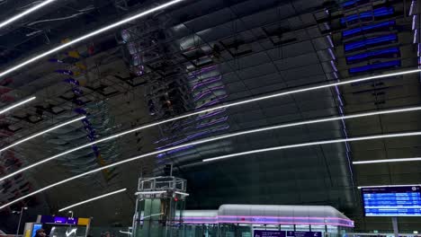 Tilt-up-shot-of-modern-train-station-at-airport-in-Frankfurt-with-travelling-people