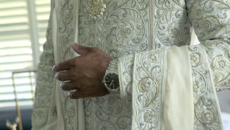 Male-Indian-Groom-Preparing-For-Hindu-Wedding-Ceremony-Dressed-in-Sherwani