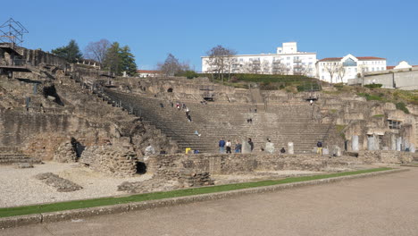 Tourists-explore-Ancient-Theatre-of-Fourvière-in-Lyon,-France