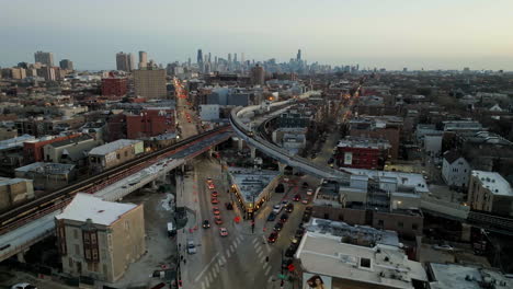 Aerial-view-of-a-commuter-train-on-a-urban-rails,-sunny-morning-in-Wrigleyville-Chicago,-USA