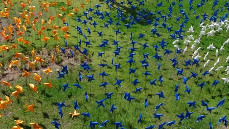 Hundreds-and-thousands-of-colourful-pinwheel-hand-windmills-spinning-in-the-wind-breeze-in-Labuan-Bajo-town,-Flores-Island,-Indonesia