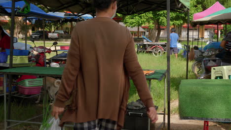 Woman-selling-fresh-food-on-local-farmer's-market-in-Asia