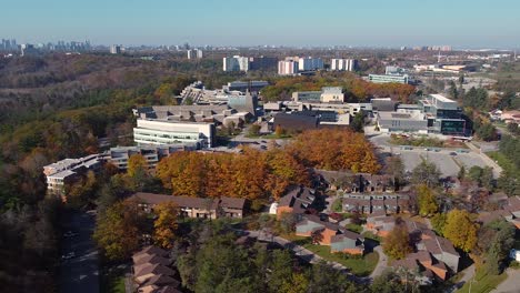 Public-transit-bus-arriving-at-University-of-Toronto-Scarborough-campus-and-student-residences-in-Fall