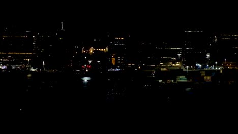 Night-time-with-city-building-lights-in-Capital-Wellington-in-New-Zealand-Aotearoa-with-lights-reflecting-over-harbour