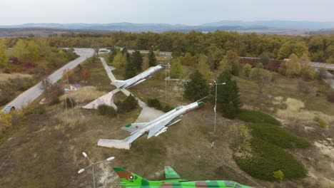 Aerial-panning-footage-of-military-airplanes-outdoor-museum-exhibition