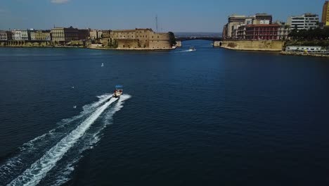 Aerial-view-of-Boat-in-Taranto-Harbour