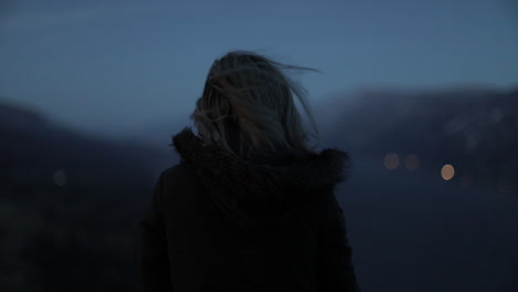 A-girl-gazes-out-at-a-gorge-from-a-scenic-viewpoint