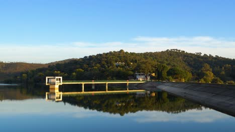 Perfect-mirror-on-water-reservoir-enclosed-by-dam-structure-"Barrage-du-Trapan