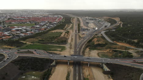 Drone-ascending-above-Train-driving-to-the-end-of-the-track-on-Joondalup-Butler-line-between-Clarkson-and-Butler-Station-in-Perth-Western-Australia