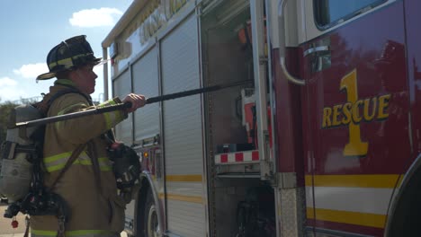 Firefighter-walking-towards-firetruck-after-a-firefighting-and-rescue-operation