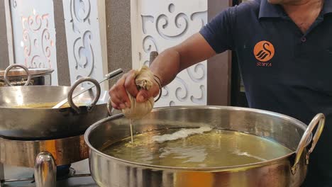 a-man-making-a-famous-sweet-in-delhi-in-one-of-the-marriage-functions-in-delhi-street-foods-making