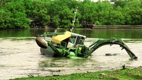 Dredgers-perform-cleaning-and-maintenance-work-on-the-Iloilo-River,-Western-Visayas,-Philippines