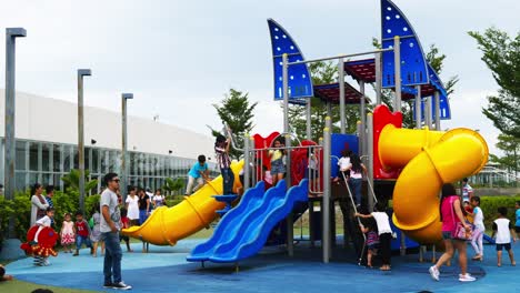 Supervised-by-parents-and-guardians,-frolicking-young-kids-explore-the-playground-attractions-at-SM-Seaside-Mall-on-South-Road-Properties,-Cebu-City,-Philippines