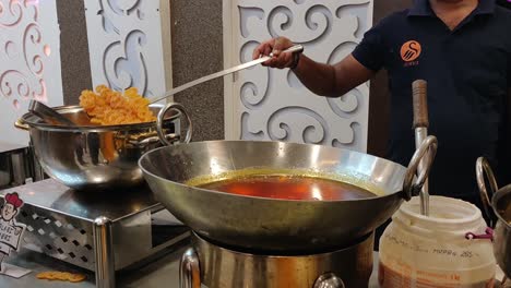 a-man-making-a-famous-sweet-in-delhi-in-one-of-the-marriage-functions-in-delhi-street-foods-making