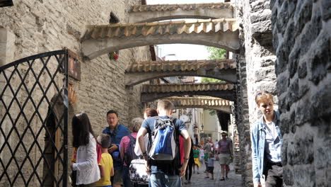 People-visiting-Saint-Catharine's-Passage-in-the-old-city-center-of-Tallinn