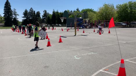 Kids-riding-bicycles-and-scooters-at-a-local-elementary-school