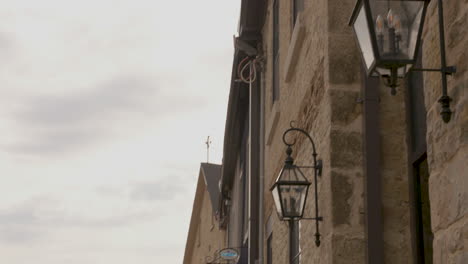 Pan-down-from-a-lantern-to-reveal-the-picturesque-streetscape-of-Elora,-Ontario,-Canada