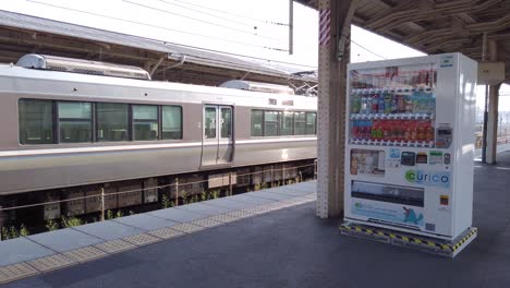 Pan-left-over-platform-while-train-prepares-to-depart