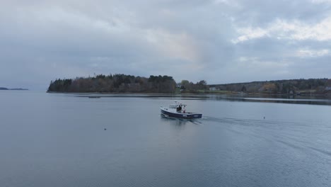 Fishing-boat-heads-out-to-sea-at-Dawn-Aerial