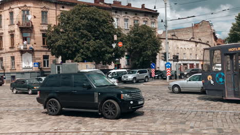 Slowmotion:-High-traffic-at-the-intersection-in-Lviv,-mess-and-chaos-on-the-road,-various-cars-and-public-transport-in-the-middle-of-the-intersection