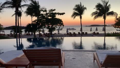 Oceanfront-resort-with-infinity-pool-looking-out-into-the-sunset-at-the-St