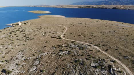 Aerial-view-on-an-Adriatic-island-with-rural-church-in-the-early-morning