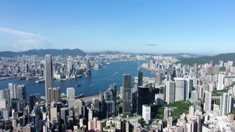 Hong-Kong-skyline-with-skyscrapers-and-bay-view-on-a-beautiful-clear-day,-Aerial-view