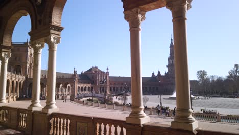 View-of-fountain-walking-past-marble-columns-in-Plaza-de-Espana,-Seville,-Spain