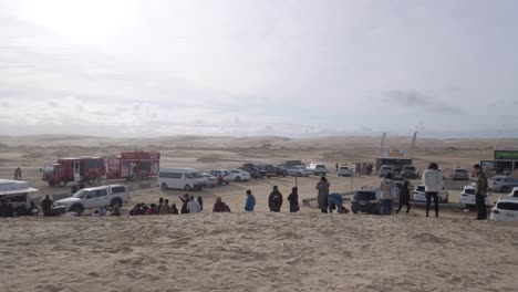 Tourists-queue-for-Oakfield-Ranch-Camel-Rides-at-the-sand-dunes-in-Anna-Bay