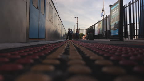 Train-arriving-at-Balaclava-Railway-Station,-people-getting-on-and-off-train,-day-time,-Melbourne-Australia-Victoria