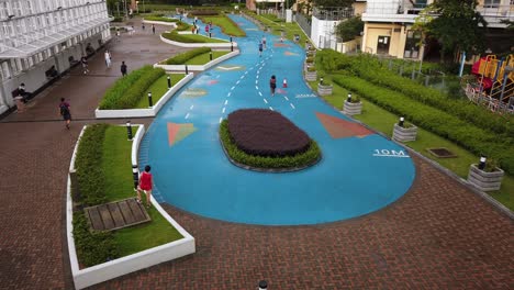 Locals-jog-and-exercise-on-a-designated-path-in-central-Hong-Kong,-Aerial-view