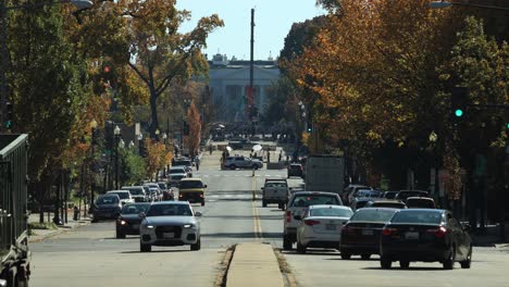 Vehicles-Driving-At-Urban-Street-Near-Lafayette-Square-In-President's-Park,-Washington-D