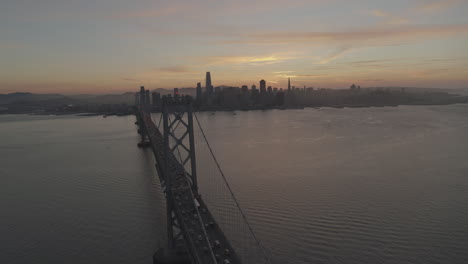 A-suspension-bridge-carrying-traffic-stretches-across-a-body-of-water