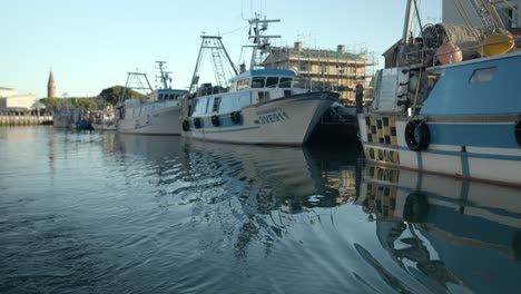 Fishing-boats-moored-in-a-quay-of-Venice,-Italy