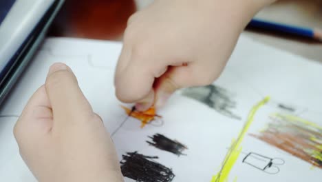 asian-toddler-coloring-with-crayon-at-home