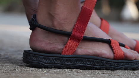 Hiker-Girl-putting-on-her-trekking-sandals-before-hiking-a-mountain-in-the-Philippines