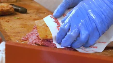 Men-preparing-classic-Italian-sandwiches,-Florence,-Italy