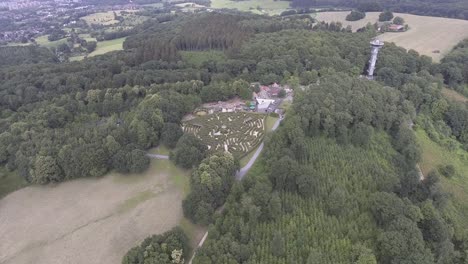 A-drone-shot-flying-high-and-panning-left,-whilst-showing-a-maze-in-the-middle-of-the-frame,-in-the-Netherlands