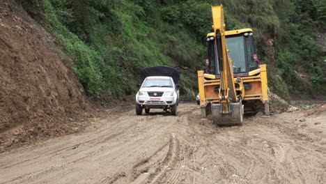 Kathmandu,-Nepal---September-27,-2019:-Traffic-and-vehicles-on-a-dangerous,-muddy-mountain-road-in-the-foothills-of-Kathmandu,-Nepal-on-September-27,-2019