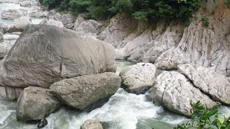 Stream-flowing-water-with-rocky-terrain-in-a-public-park