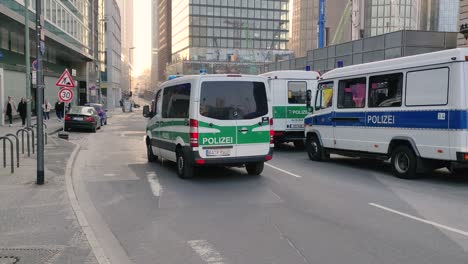 Police-cars-driving-trough-the-centre-of-Frankfurt,-Germany