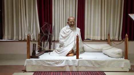 Statue-of-Father-Of-Nation-Mahatma-Gandhi-with-'Charkha'-at-a-Museum-in-Dehradun,-Uttarakhand-India