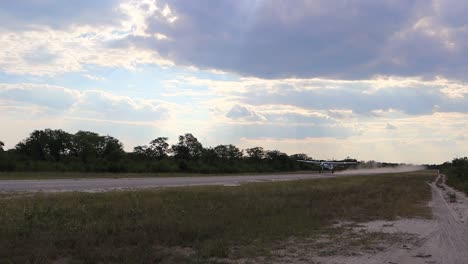 Small-Mack-Air-charter-airplane-takes-off-from-African-dirt-runway