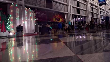 Slow-zoom-out-time-lapse-of-a-busy-airport-terminal-at-O'Hare-International-airport-on-Dec-26th