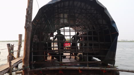 Fishing-boat-crew-prepping-to-leave-the-dock-for-the-day-in-Kerala,-India