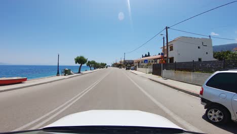 Driver-POV-hyperlapse-travel-through-a-coastal-village-in-south-Europe