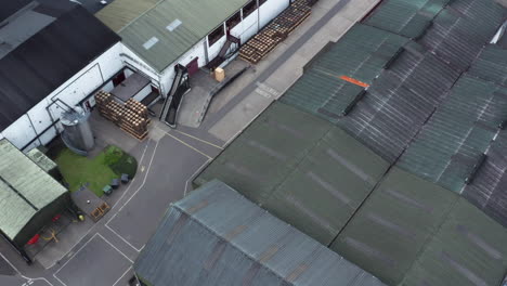 Tilt-down-aerial-over-the-Old-Bushmills-Distillery-Northern-Ireland