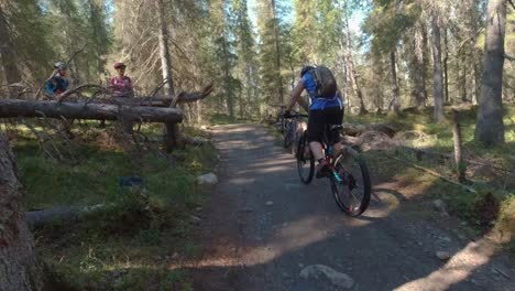 Women-mountain-biker-splashing-over-river-by-mountain-bike